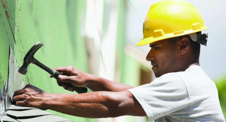 Image of Man Working On Roof